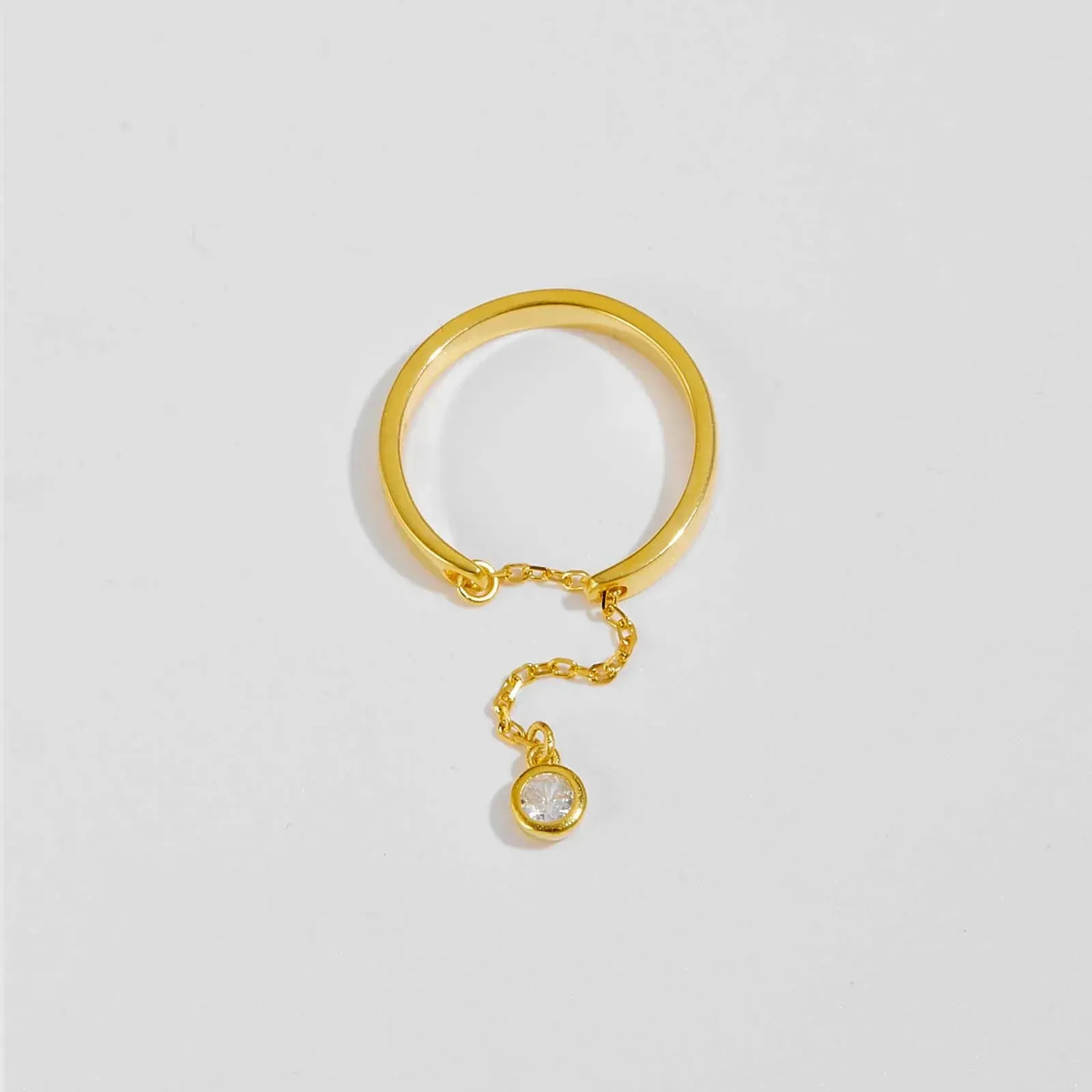 Регулируем фин сребърен пръстен с квадратен циркон и позлата